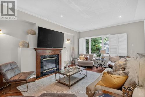 Family room with gas fireplace - 11 Taj Court, Ottawa, ON 