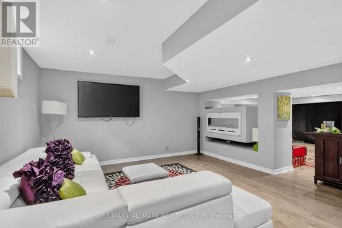 Other side with electric fireplace used as 2 rooms - 11 Taj Court, Ottawa, ON 