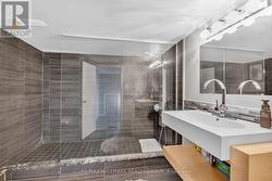 Lower level bathroom full width walk-in shower - 