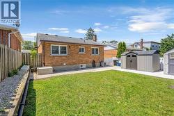 Expansive grassy yard with concrete patio areas - 