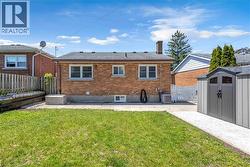 Brick exterior featuring a gabled roof and white window frames - 