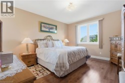 Wood-finish flooring with a neutral wall palette and white trim - 
