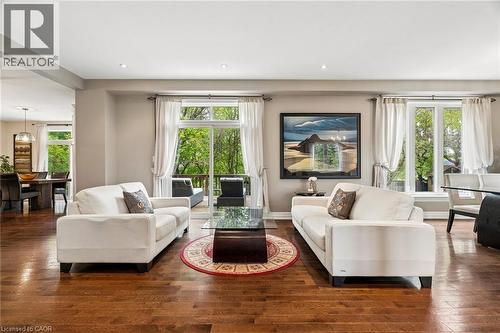 Open-concept living space featuring wood-finish flooring, recessed lighting, and a neutral wall palette - 1541 Garnet Avenue, Mississauga, ON 
