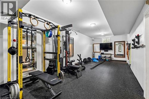 Spacious exercise room featuring durable rubber flooring and recessed lighting - 1541 Garnet Avenue, Mississauga, ON 
