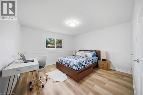 Room featuring light vinyl flooring, white walls, and a single window offering exterior views - 2306 Devon Road, Oakville, ON 