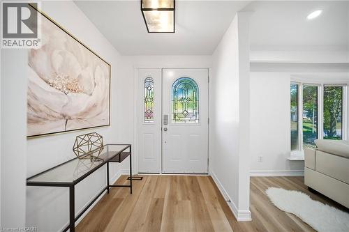Entryway featuring vinyl flooring and a white front door with decorative stained glass - 2306 Devon Road, Oakville, ON 
