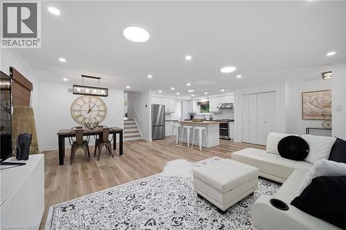 Open-concept living space featuring vinyl flooring, recessed lighting, and multiple skylights - 2306 Devon Road, Oakville, ON 