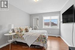 Primary bedroom with hardwood floors - 