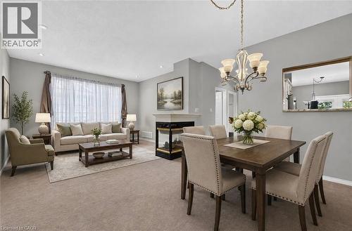 This photo of the living / dining room has been virtually staged. - 159 Thoroughbred Boulevard, Ancaster, ON 