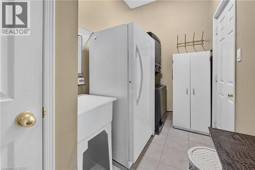 Main floor laundry room and door to the garage - 159 Thoroughbred Boulevard, Ancaster, ON 