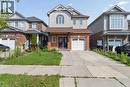 Two-story facade with brick and siding accents, featuring an attached single-car garage - 242 Moorlands Crescent, Kitchener, ON 