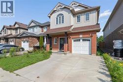Brick and siding exterior with a single-car garage and concrete driveway - 