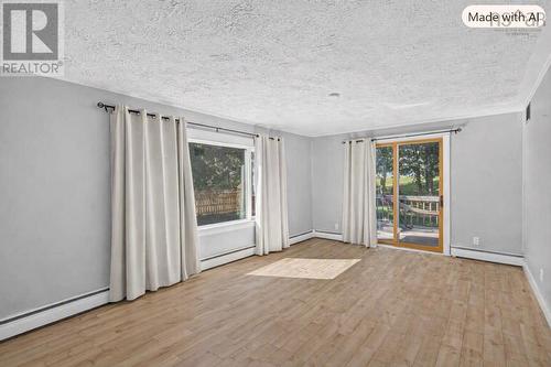 Living Room with patio doors to back patio. - 79 Second Avenue, Digby, NS 
