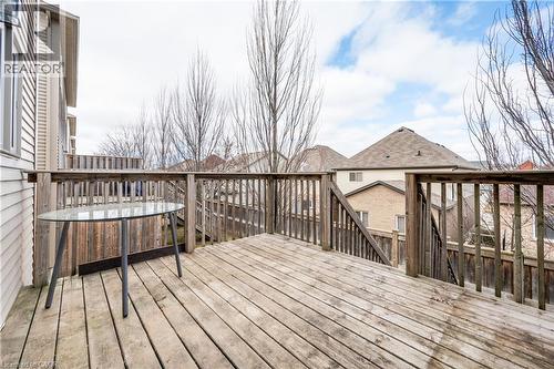 Expansive outdoor wood deck with natural wood railing and a set of exterior stairs - 224 Jessica Crescent Unit# B, Kitchener, ON 
