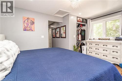 Recessed lighting, window with exterior exposure, open shelving, and a decorative light fixture - 52 Charters Road, Brampton, ON 
