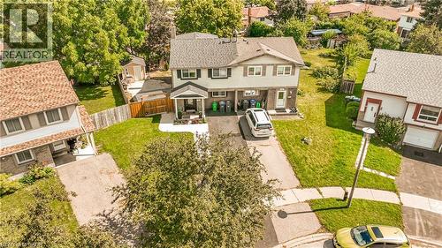 Attached two-story residence featuring a front porch and a paved driveway - 52 Charters Road, Brampton, ON 