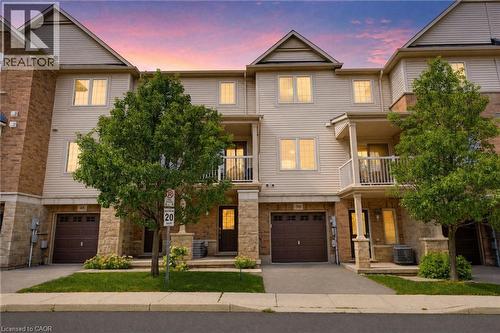 Multi-level townhome featuring a stone and siding facade - 541 Winston Road Unit# 50, Grimsby, ON 