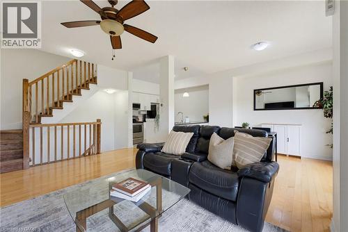 Wood-finish flooring throughout, with a wood-spindled staircase - 541 Winston Road Unit# 50, Grimsby, ON 