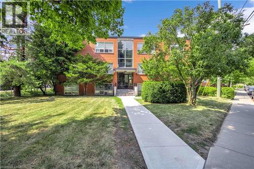 Front of Building with new concrete sidewalk - 57 Mericourt Road Unit# 310, Hamilton, ON 