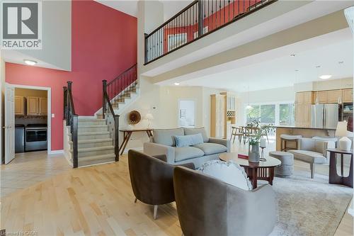 Two-story entry with an open-tread staircase and a second-level balcony - 227 Chestnut Hill Crescent, Kitchener, ON 