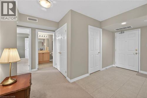 Front foyer with view of main 3 piece bathroom - 908 Mohawk Road E Unit# 308, Hamilton, ON 