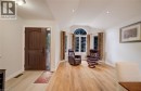 Wood-finish flooring throughout, vaulted ceiling, recessed lighting, and an arched window - 245 Fern Crescent, Waterloo, ON 