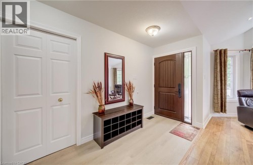 Light wood-finish flooring extending into the room - 245 Fern Crescent, Waterloo, ON 