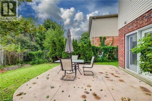 Private backyard with a concrete patio - 245 Fern Crescent, Waterloo, ON 