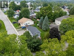 Residential property with a gray shingle roof and light gray siding - 