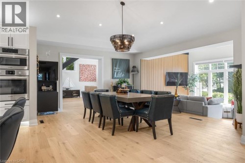 Hardwood flooring, recessed lighting, built-in stainless steel appliances, large windows, and a decorative chandelier - 293 North Shore Boulevard E, Burlington, ON 