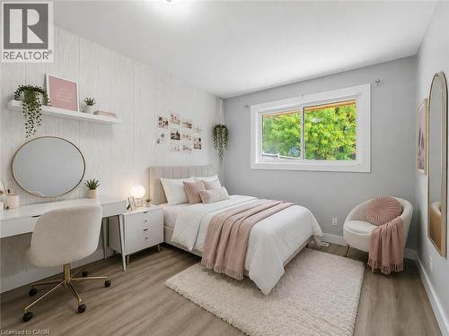 Recessed lighting, wood-finish flooring, and a window with white trim - 220 Cairn Street, London, ON 