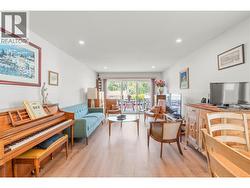 virtually edited (area rug removed to showcase more of the flooring) - 