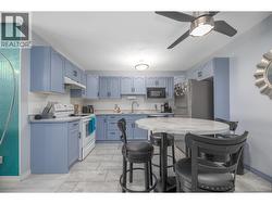 The kitchen opens to a bright breakfast area with room for everyday meals and conversation. - 