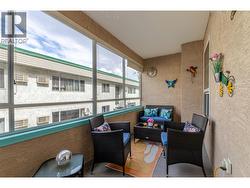 A comfortable seating area makes the covered sun deck ideal for coffee, reading or visiting with friends. - 