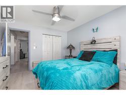 The primary bedroom includes a full-width closet for convenient storage. - 