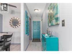 The colourful front entry opens directly toward the kitchen and main living areas. - 