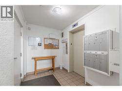 The building lobby includes secured entry, mailboxes and convenient elevator access. - 
