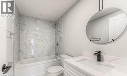 White vanity with an integrated rectangular sink and quartz countertop - 