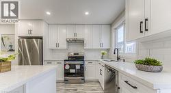 White cabinetry and quartz countertops - 