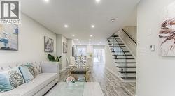 Recessed lighting illuminates wood-finish flooring throughout - 