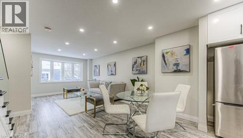 Recessed lighting illuminates wood-finish flooring - 152 Overlea Drive, Kitchener, ON 