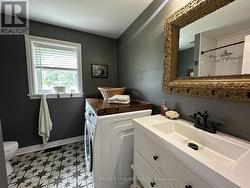 Main floor 3 piece bathroom and laundry room. - 