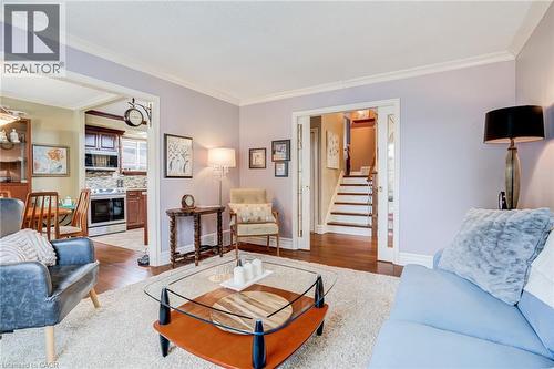 Archway entry to kitchen and dining area with hardwood flooring - 106 Appleford Road, Hamilton, ON 