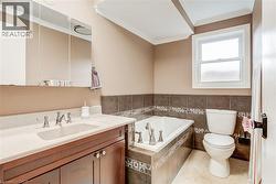 Built-in soaking tub with decorative tile surround - 