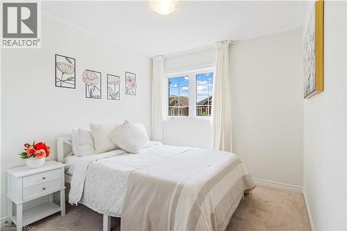 Carpeted flooring, white walls, crown molding, double-pane window, flush mount lighting - 68 Barkerville Drive, Whitby, ON 