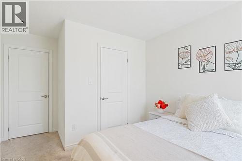Wall-to-wall carpeting and white interior doors with satin nickel hardware - 68 Barkerville Drive, Whitby, ON 