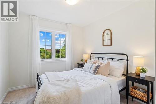 Window with white gridded panes, light-colored walls, and carpeting - 68 Barkerville Drive, Whitby, ON 