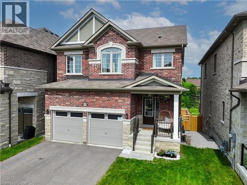 Brick and stone facade with a covered front porch - 68 Barkerville Drive, Whitby, ON 