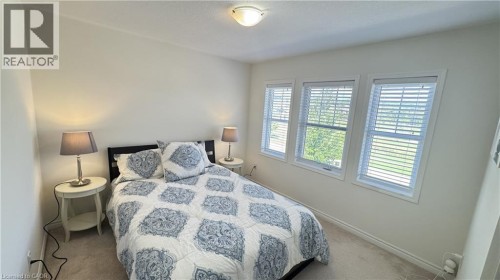 Recessed ceiling light fixture and three windows with white blinds - 67 Pointer Street, Cambridge, ON 