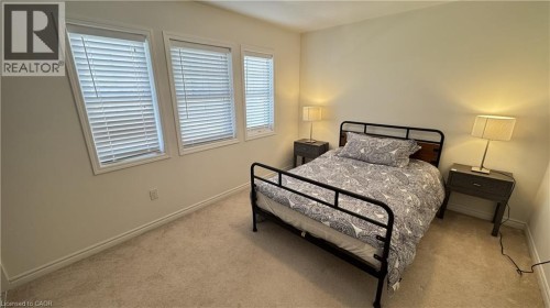 Carpeted room with multiple windows featuring blinds - 67 Pointer Street, Cambridge, ON 